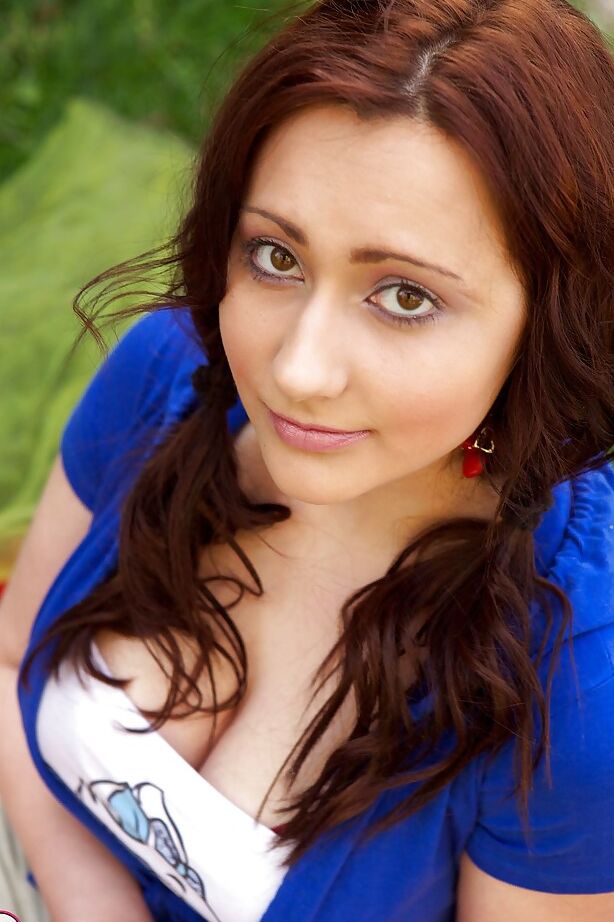 11P Busty young girl Diana inserting sex toy into twat in field next to pool