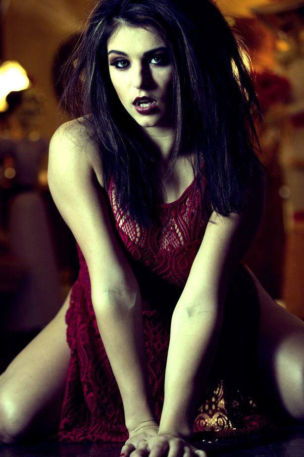 14P Leah Gotti portraying a dark, seductive, and mysterious appeal filled with
