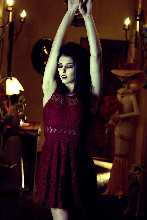 14P Leah Gotti portraying a dark, seductive, and mysterious appeal filled with