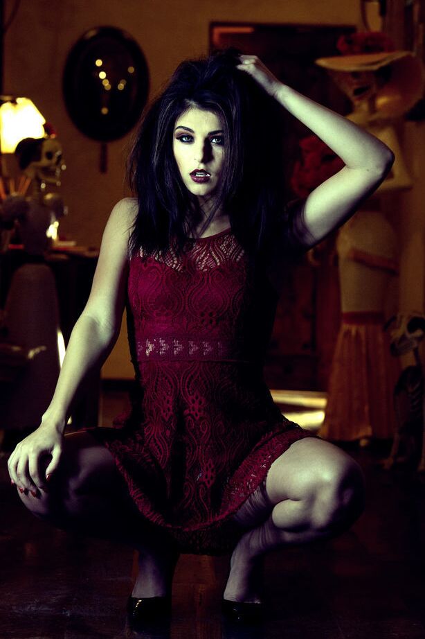 14P Leah Gotti portraying a dark, seductive, and mysterious appeal filled with
