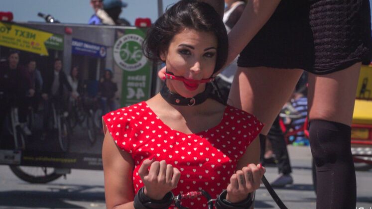 13P Dark-haired girl is paraded nude through public streets before being suspended