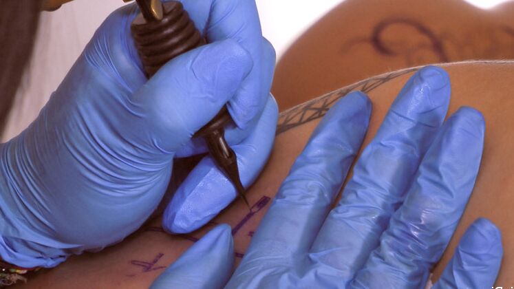 12P Brunette chick gets a new tattoo before a bout of public fucking