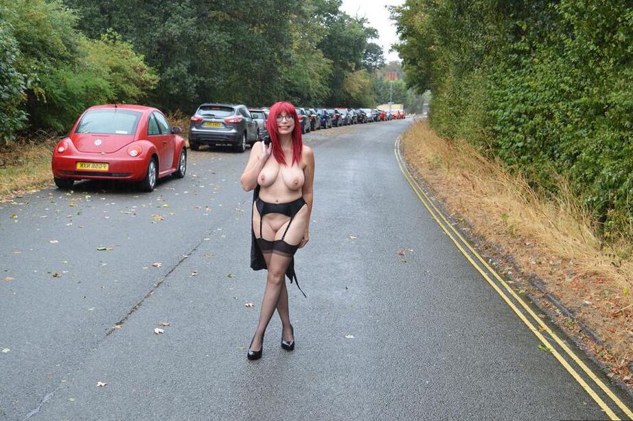 15P Mature redhead Barby Slut gets naked in public places on a wet day