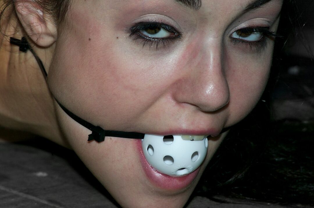 17P Ball gagged brunette Sasha Grey is masturbated while affixed to table