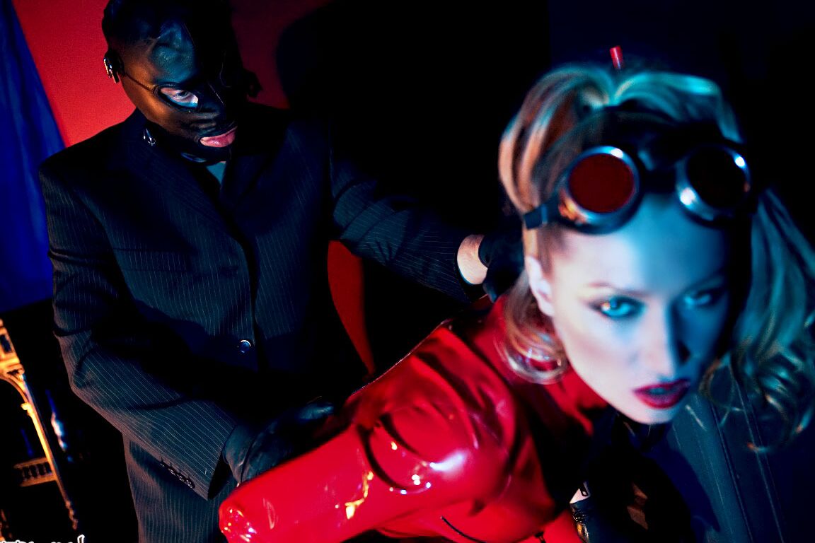 15P Hot MILF Diana Doll unzips latex bodysuit to ride a latex clad man's hard dick