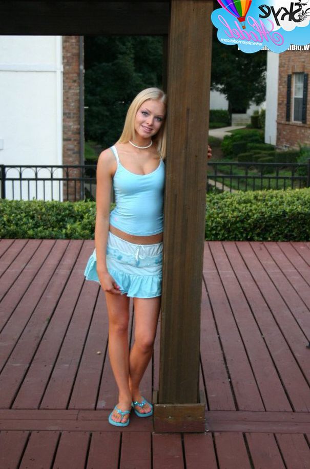 12P Blonde amateur Skye Model flashes an upskirt butt cheek on the back patio