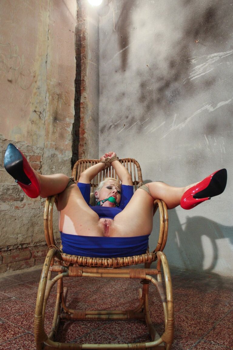 17P Gagged slut in blue dress and red heels tied up to chair and fucked by machine