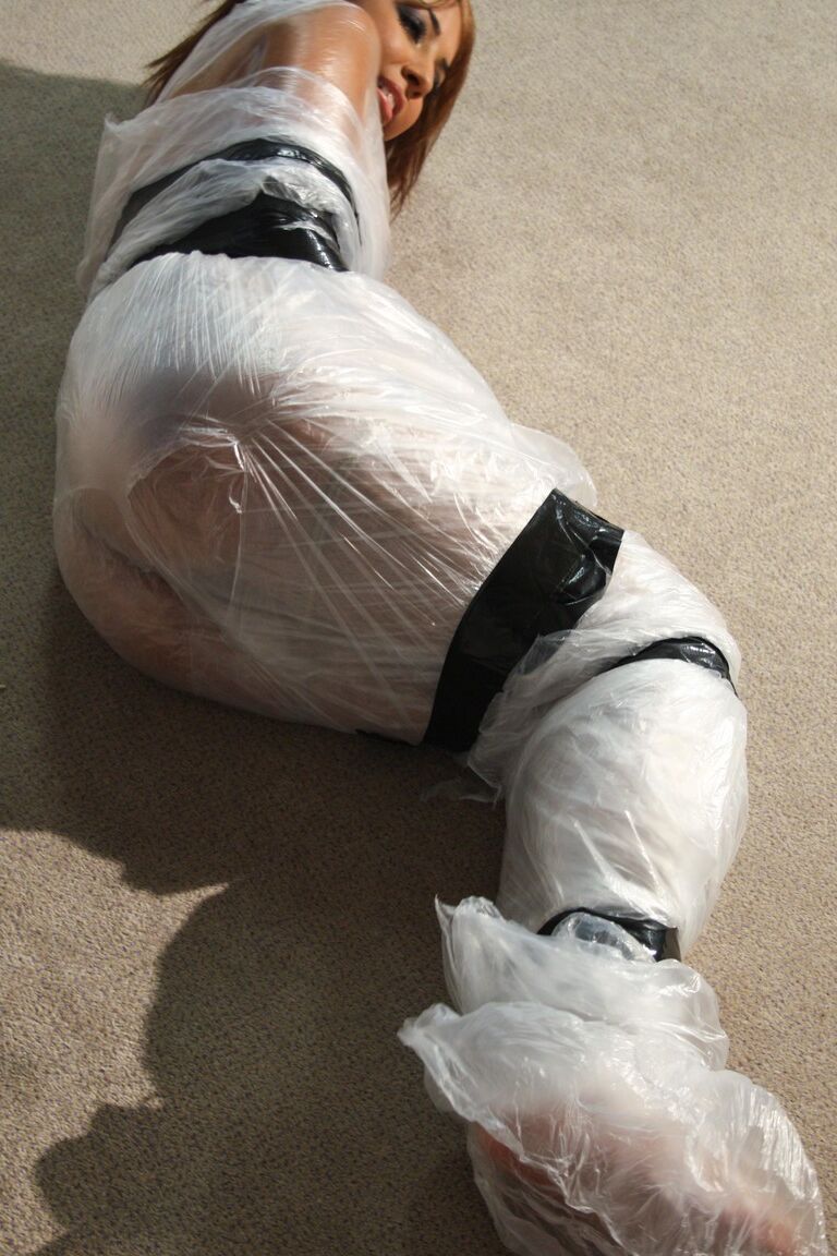 19P Poor slut Kayla moans while being covered in special plastic film