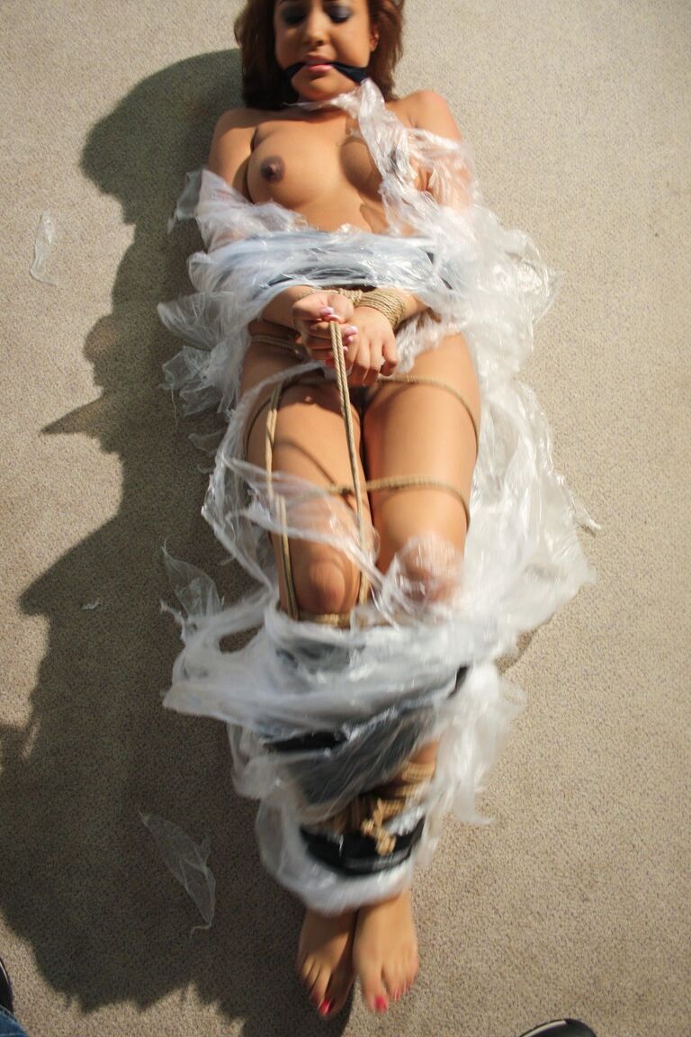 19P Poor slut Kayla moans while being covered in special plastic film