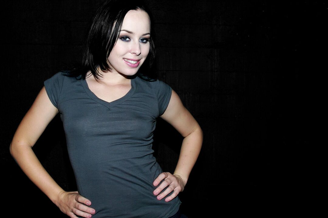 17P White female Alexa Von Tess poses fully clothed in a miniskirt and heels