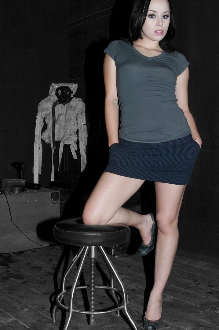 17P White female Alexa Von Tess poses fully clothed in a miniskirt and heels