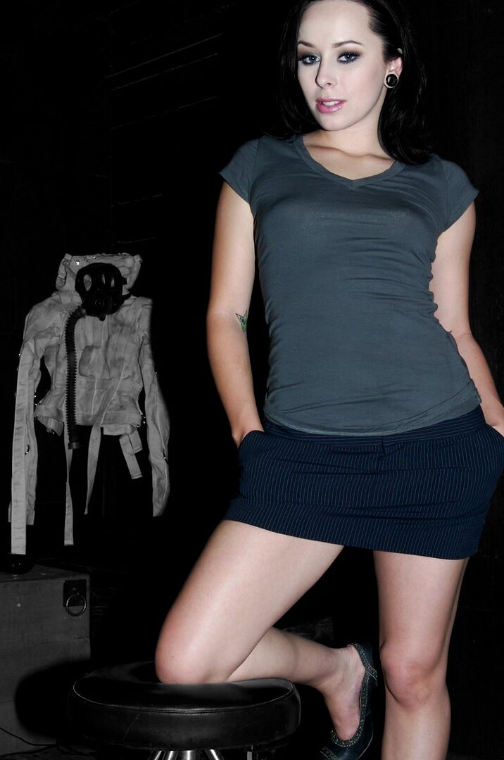 17P White female Alexa Von Tess poses fully clothed in a miniskirt and heels