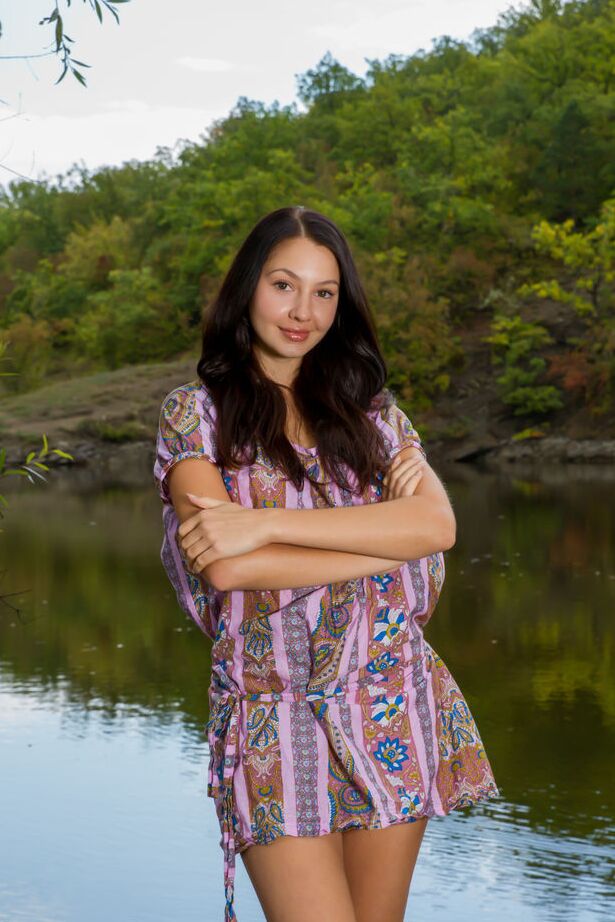 16P Barely legal brunette Gratidia N gets totally naked next to calm waters