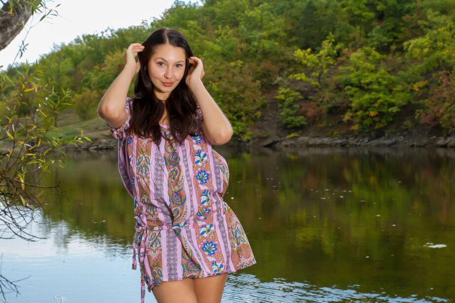 16P Barely legal brunette Gratidia N gets totally naked next to calm waters