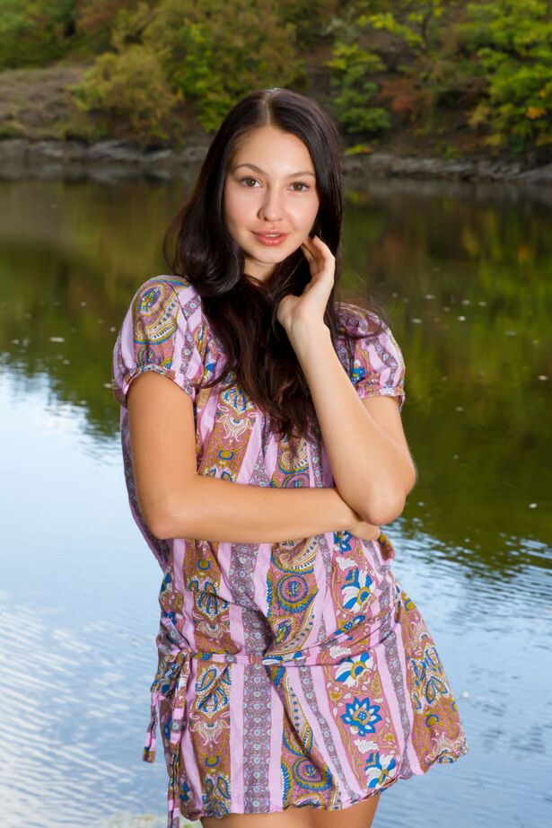 16P Barely legal brunette Gratidia N gets totally naked next to calm waters