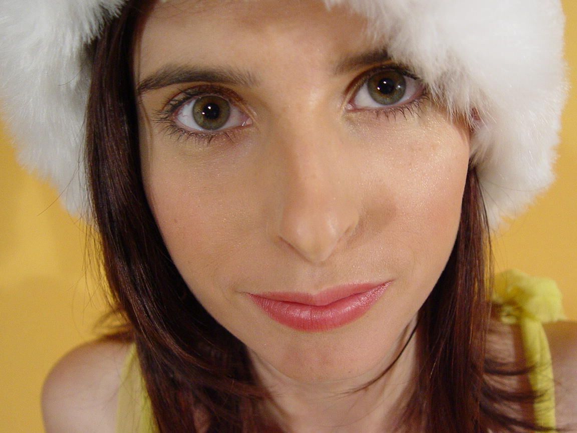 16P Busty amateur gets naked in a Christmas cap and over the knee socks
