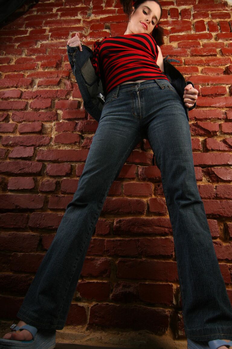 16P Busty amateur strips to her shoes against a brick wall while in pigtails