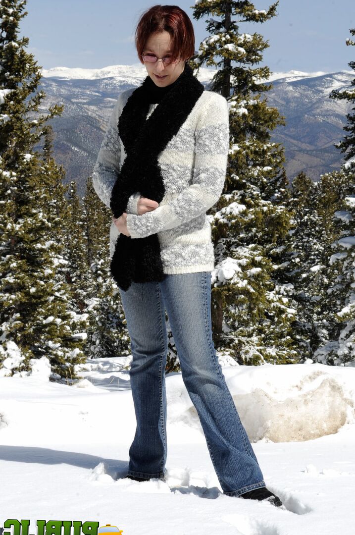 21P Naughty redhead Brandi de Lafey gives a snowman a CFNM handjob in the woods