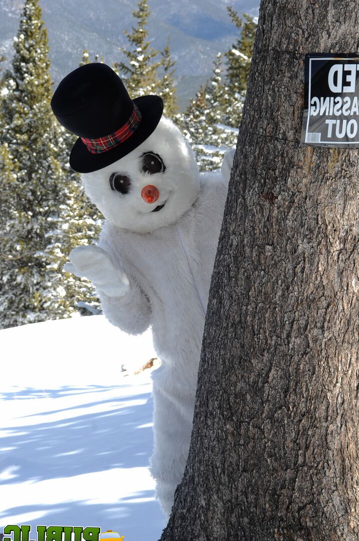 21P Naughty redhead Brandi de Lafey gives a snowman a CFNM handjob in the woods