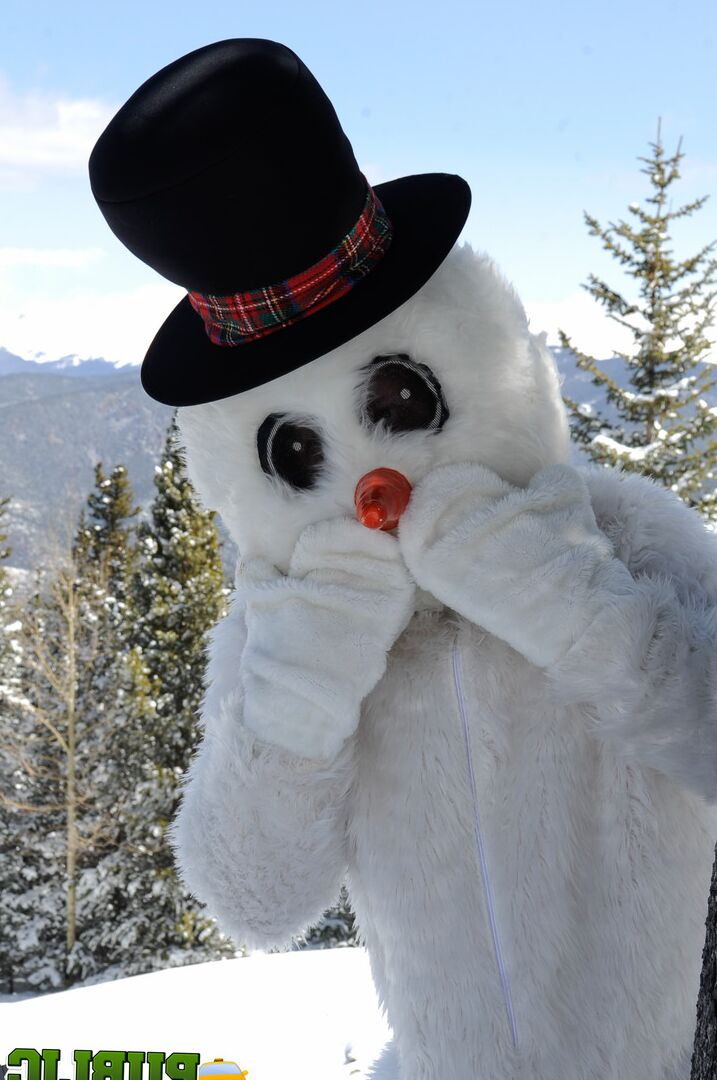 21P Naughty redhead Brandi de Lafey gives a snowman a CFNM handjob in the woods