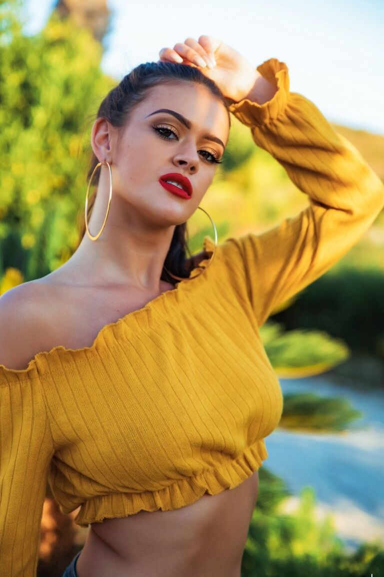 12P UK model Brook Wright sports red lips while uncovering her great tits
