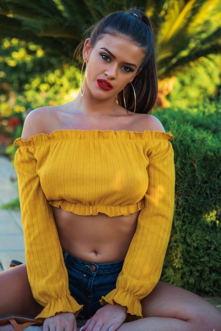 12P UK model Brook Wright sports red lips while uncovering her great tits