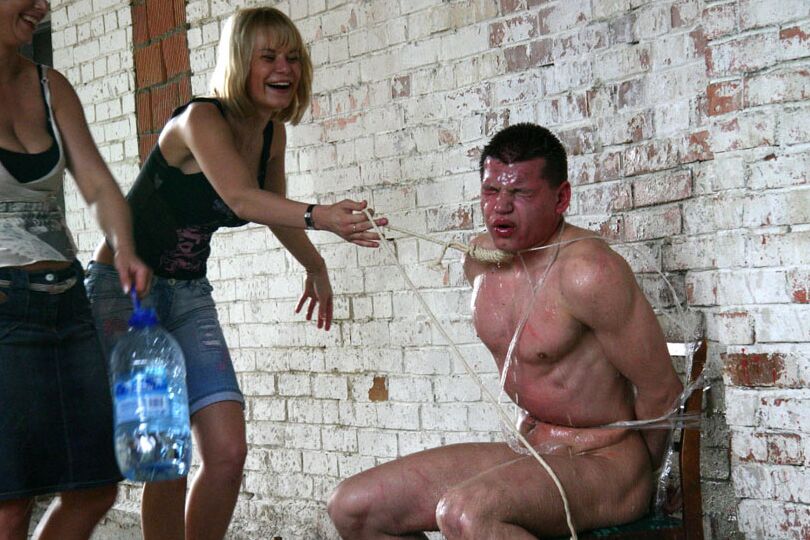 16P Busty bitches torture a naked guy tied to a chair in an abandoned farm