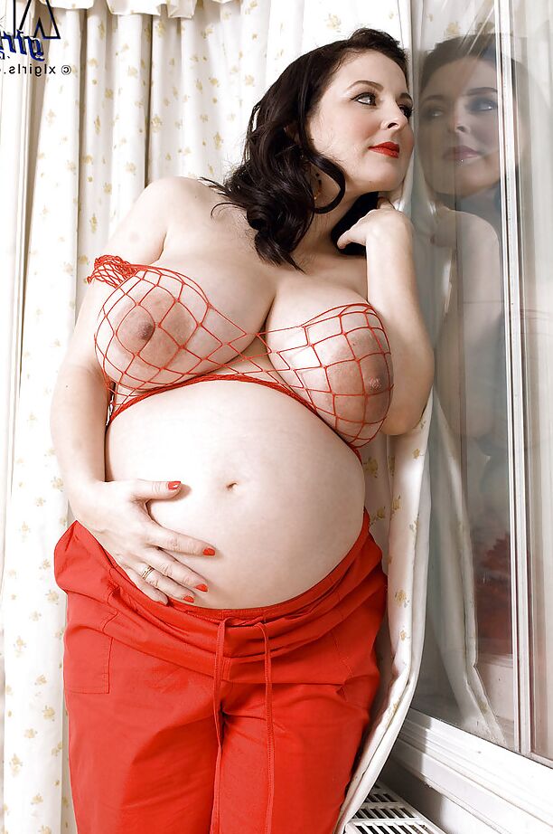16P Brunette preggo with fat tits Lorna Morgan posing in fishnet bra and black panties