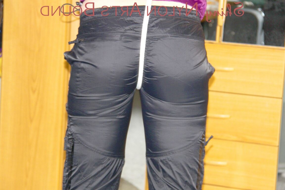 16P PIA wearing sexy shiny nylon rain pants and a purple rain jacket crotchroped