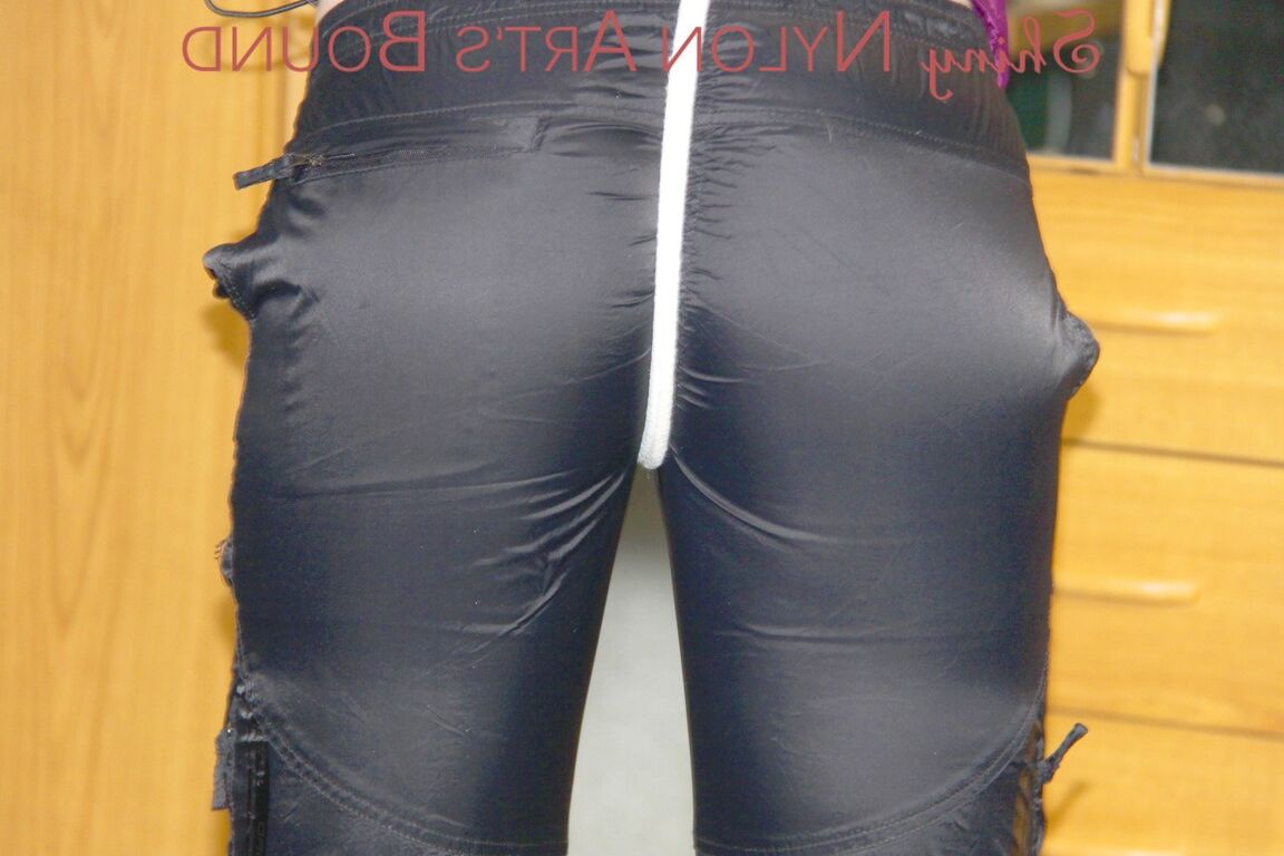 16P PIA wearing sexy shiny nylon rain pants and a purple rain jacket crotchroped