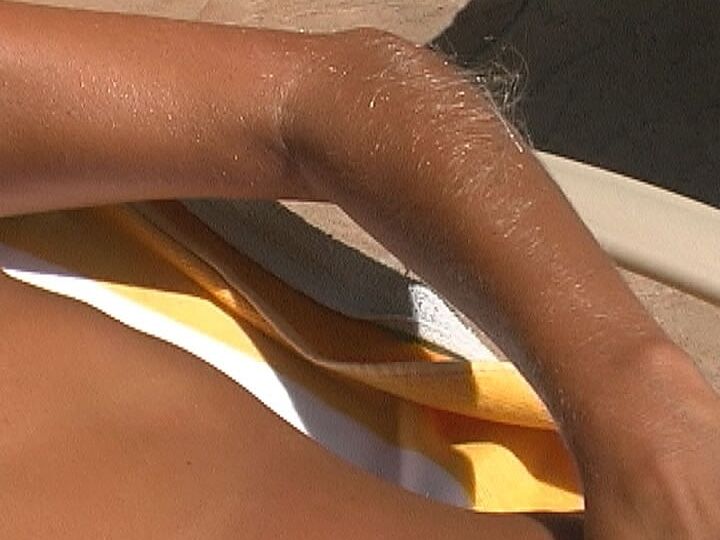 21P Beautiful tanned Lori Anderson teases with her hairy arms while sunbathing