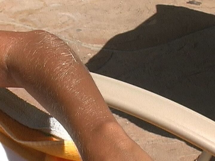 21P Beautiful tanned Lori Anderson teases with her hairy arms while sunbathing