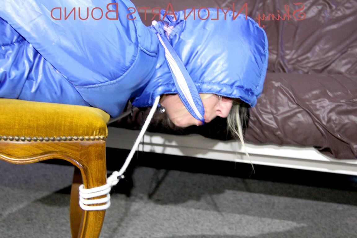 16P PIA tied, gagged and hooded on a stool and on the ceiling wearing a supersecy