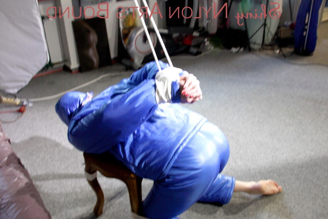 16P PIA tied, gagged and hooded on a stool and on the ceiling wearing a supersecy
