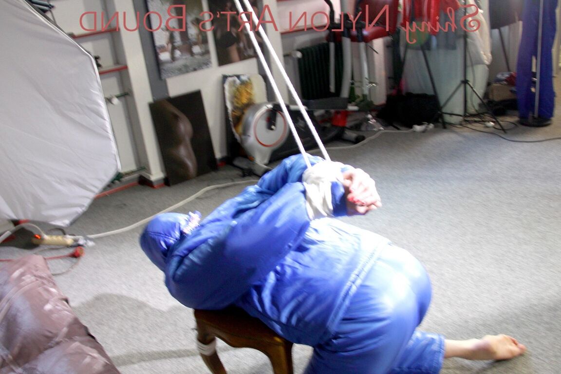 16P PIA tied, gagged and hooded on a stool and on the ceiling wearing a supersecy