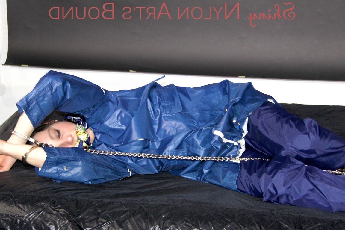 16P Lucy tied with cuffs overhead and gagged with a clothgag wearing sexy blue
