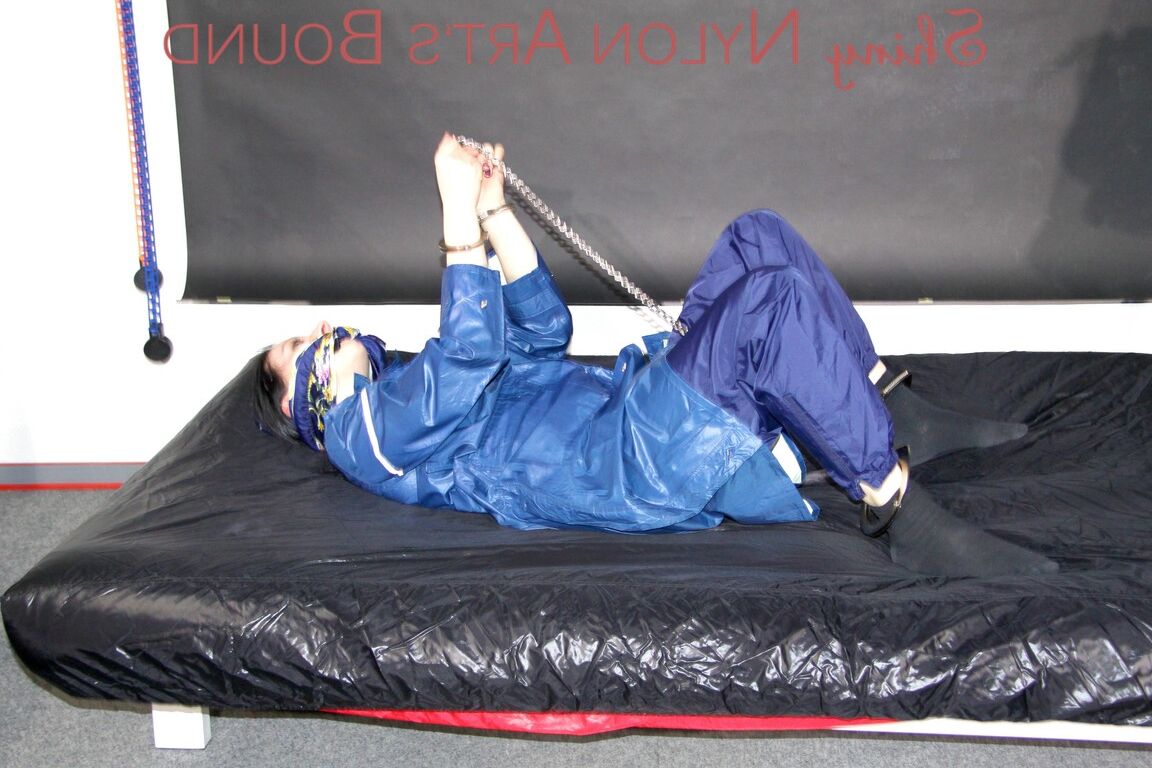 16P Lucy tied with cuffs overhead and gagged with a clothgag wearing sexy blue