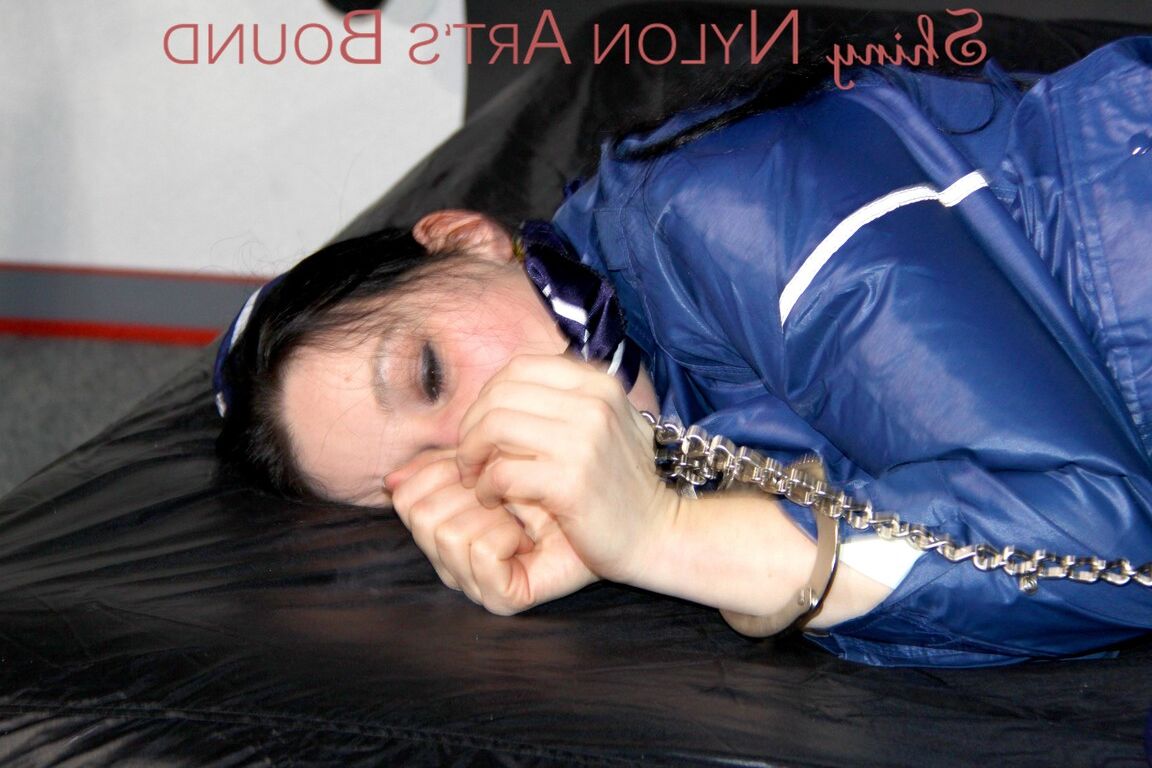 16P Lucy tied with cuffs overhead and gagged with a clothgag wearing sexy blue