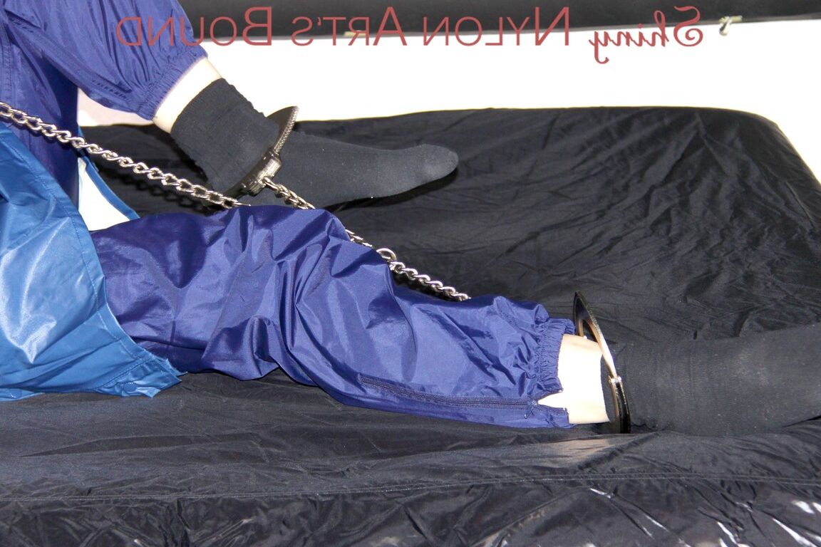 16P Lucy tied with cuffs overhead and gagged with a clothgag wearing sexy blue