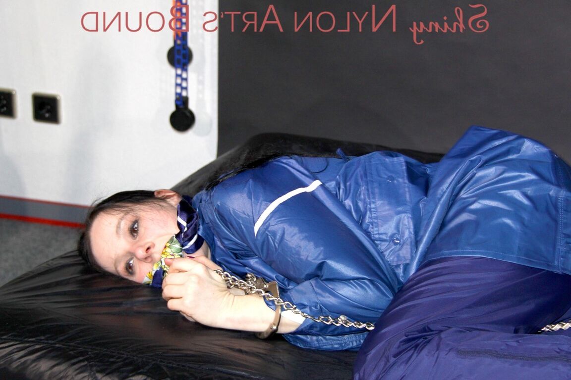 16P Lucy tied with cuffs overhead and gagged with a clothgag wearing sexy blue