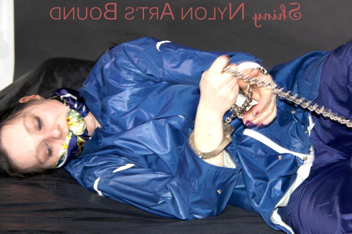 16P Lucy tied with cuffs overhead and gagged with a clothgag wearing sexy blue