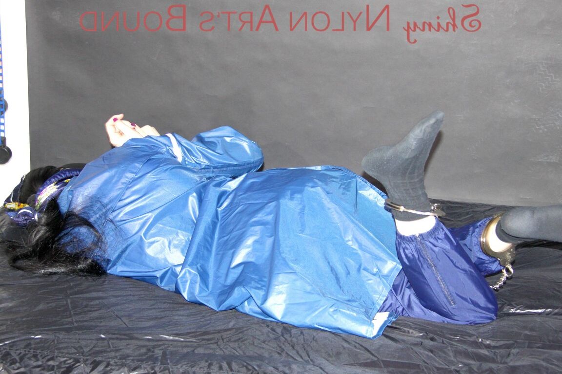 16P Lucy tied with cuffs overhead and gagged with a clothgag wearing sexy blue