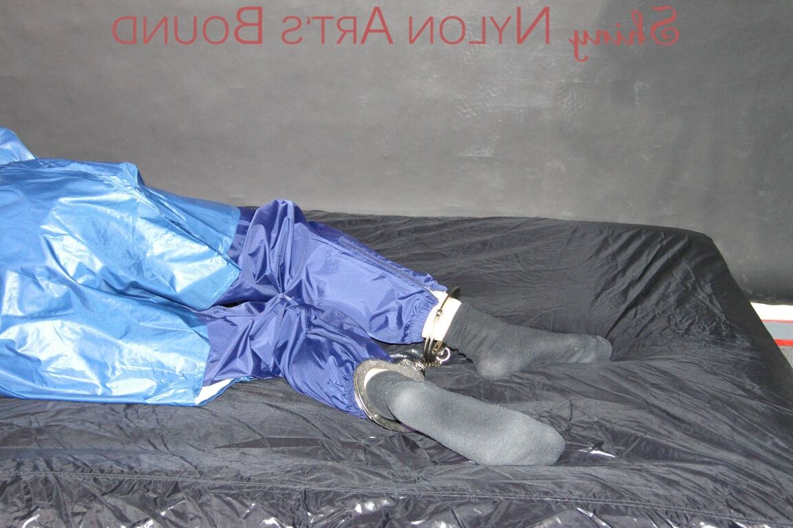 16P Lucy tied with cuffs overhead and gagged with a clothgag wearing sexy blue