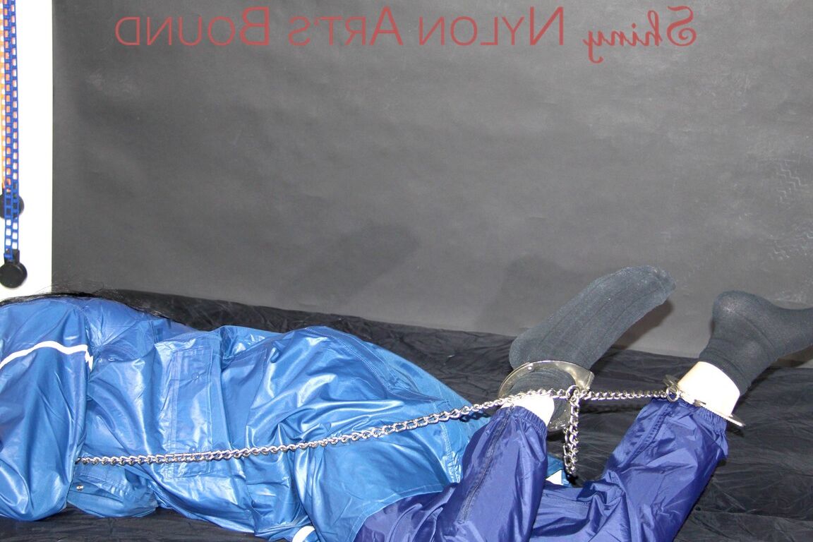 16P Lucy tied with cuffs overhead and gagged with a clothgag wearing sexy blue