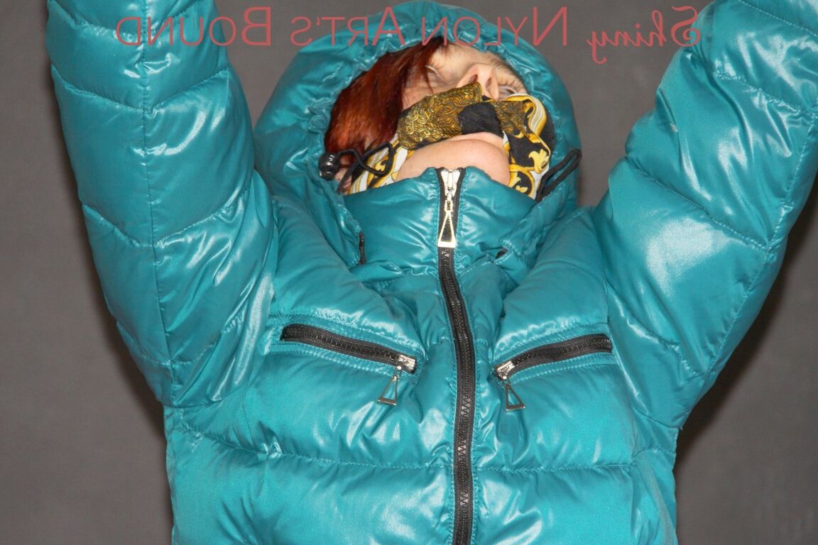 16P Sonja tied and gagged over her head on the arms wearing a sexy white shiny