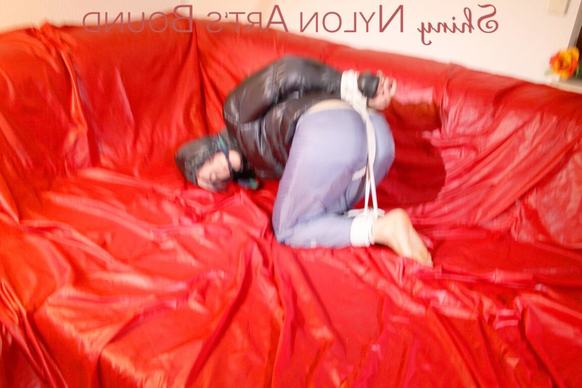 16P Sonja tied and gagged with ropes and a ball gag wearing a sexy grey shiny