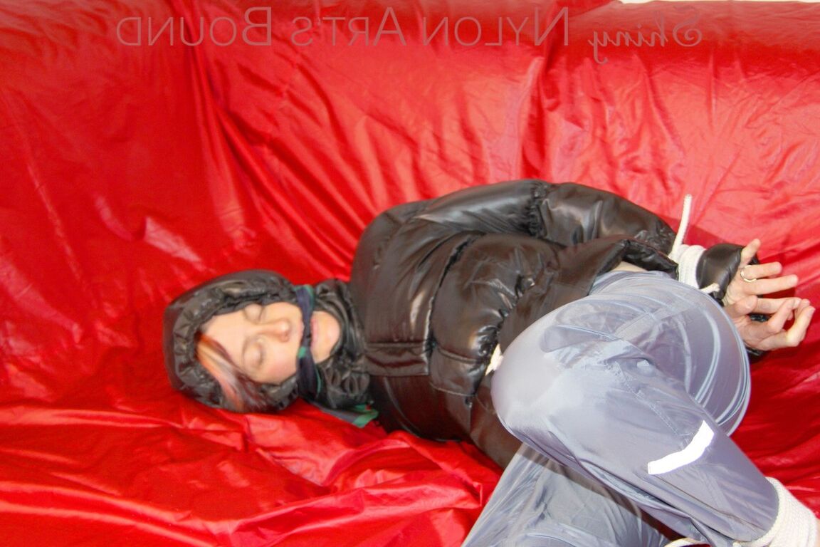 16P Sonja tied and gagged with ropes and a ball gag wearing a sexy grey shiny