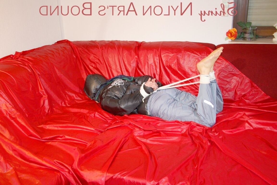 16P Sonja tied and gagged with ropes and a ball gag wearing a sexy grey shiny
