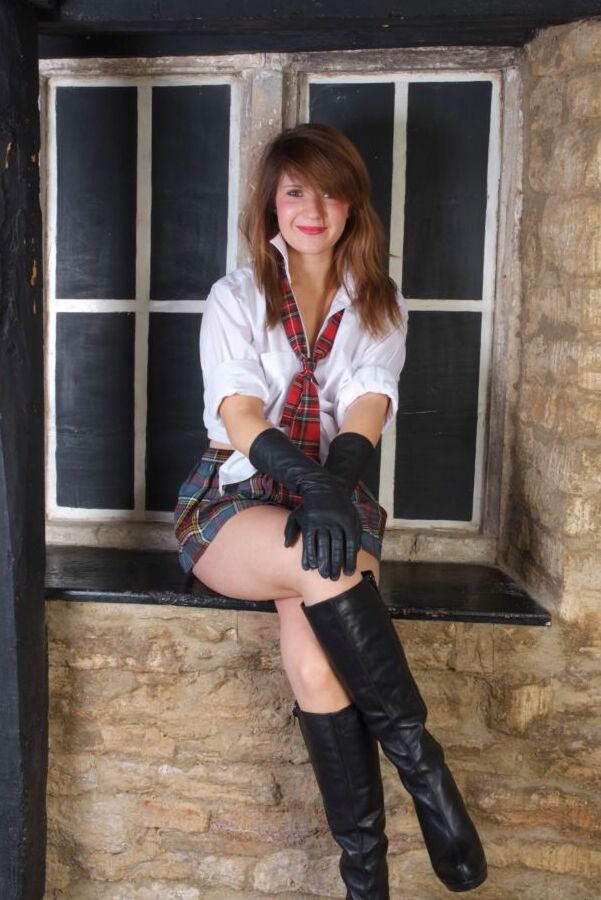 15P Redheaded student Sam exposes her ass cheeks in leather gloves and boots