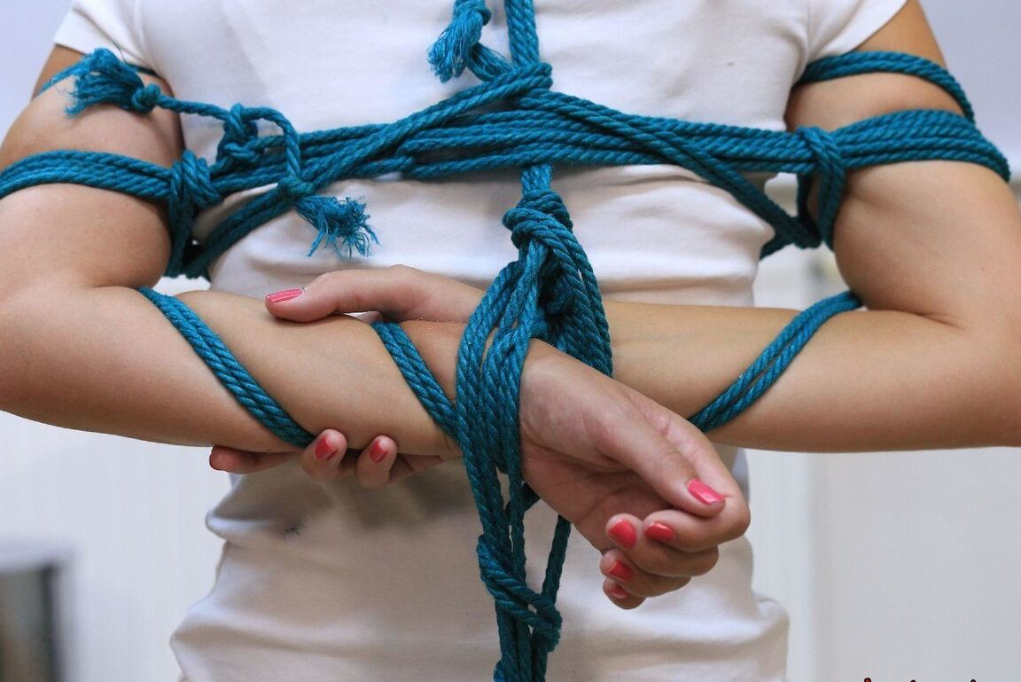 16P Caucasian female is silenced with a gag while tied to a chair in bare feet